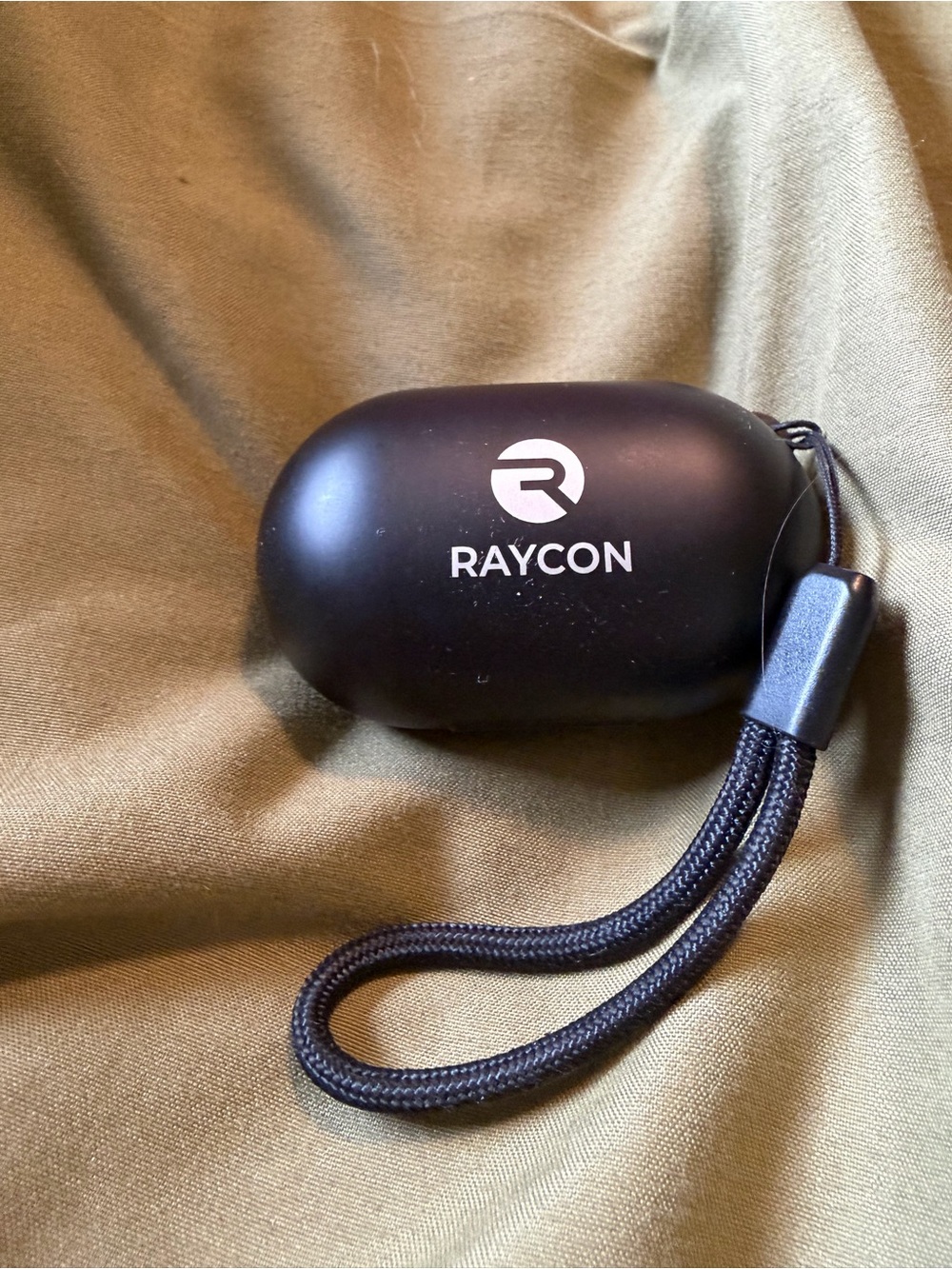Black Raycon wireless charging earbuds